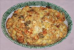 a casserole dish in a green and white bowl