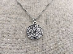 This is a understated and elegant little boho disc pendant necklace.  It is perfect for everyday wear and would go with just about anything.  The disc measures 3/4” long by 5/8” wide and is made from allergy free plated silver.  It hangs from a simple stainless steel necklace chain.I have matching earrings in my shop, if you would like the whole set.  Here is the link.......... https://etsy.me/2VZ551y Thanks for stopping by!  Please take a moment and visit the rest of my Etsy shop.    I have man Bohemian Circle Metal Necklace, Bohemian Silver Medallion Necklace Nickel Free, Bohemian Silver Charm Necklace For Gift, Bohemian Silver Charm Necklace As Gift, Silver Bohemian Charm Necklace As Gift, Bohemian Circle Jewelry For Gifts, Bohemian Sterling Silver Jewelry With Delicate Chain, Silver Delicate Chain Jewelry For Festivals, Bohemian Handmade Circle Necklace