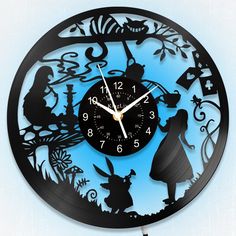 a clock with an image of alice and the rabbit on it