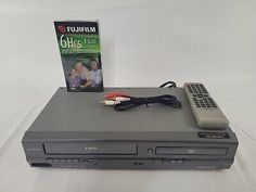 a dvd player and remote sitting on top of a table