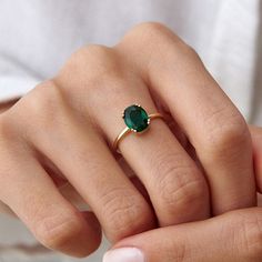 Handmade Dainty Gemstone Minimalist Ring Women's Ring Emerald Birthstone Ring Custom Jewelry Anniversary Mom Girlfriend Gift Emerald engagement rings have many meanings and represent luck, love, peace, and hope. Offering an emerald to the one you love shows intent for a happy and blessed marriage and the rich green hue of emerald represents new beginnings, whether that be in love or life. F E A T U R E S * Material: High Quality Solid Sterling Silver 925 * Stone: Quality Zirconia Gemstone * Stone Cut: Oval Cut * Stone: Emerald * Stone Type: High Quality Zirconia Gemstone * 14k gold plated jewelry is much thicker than other gold plating, resulting in a durable, long-lasting product. * Finish: Sterling Silver ∙ 14K Gold ∙ Rose Gold * Material: High Quality Solid 925 Sterling Silver * Stone D Rings For Women Green Stone, Natural Emerald Ring Simple, Green Stone Ring Gold For Women, Silver Stone Rings Women, Minimalist Rings With Prong Setting For Everyday, Minimalist Everyday Rings With Prong Setting, Gemstone Midi Promise Ring In Fine Jewelry Style, Everyday Jewelry: Open Ring With Prong Setting, Oval May Birthstone Rings For Everyday