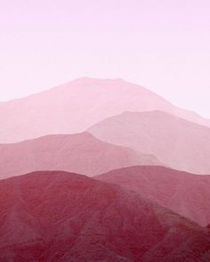 the mountains are covered in pink hues and there is no image here to provide a caption for