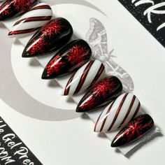 "Welcome to LD Nails!  Hi, I'm Bur and I'll be your long distance nail ghoul 😜 Read on for the obligatory written description of what you see in the pictures, plus some other important stuff..  🖤 One set of 10 REUSABLE Press On Nails 🖤     🖤 Made to order in your shape & size 🖤  Christmas Chrome: Black, white and red gothic Christmas press on nail set with hand painted red chrome snowflakes and striping detailing.  👉 Please leave your finish preference and (if applicable) custom sizing in the personalization box!  Est. 2020: LD Nails specializes in custom Gothic, Witchy and Alternative Press On Nails. I draw inspiration from what I love, so you'll find heavy gothic influences to much of the offerings in my shop!  5 ⭐️ Rating on Etsy & 1000's of orders shipped between this shop and my Holiday Horror Nails, Merry Creepmas Nails, Christmas Nails Nightmare Before, Spooky Xmas Nails, Spooky Winter Nails, Christmas Gothic Nails, Black And White Xmas Nails, Black Candy Cane Nails, Easy Nail Designs Winter