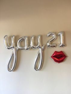 some balloons that say it's friday and the lips are in front of them