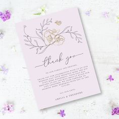 a pink thank card with flowers on it