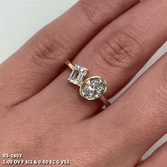 a woman's hand with an engagement ring on it, and a diamond in the middle