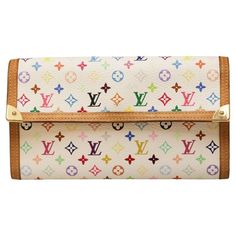 Murakami limited edition wallet with iconic LV multicolor Monogram ! Condition : good, the exterior is in very good condition but traces are visible on the inside coin pocket Made in France Material : coated canvas, leather Interior : leather Color : white, multicolor Monogram Dimensions : 19 x 11 x 1.5 cm Serial number: TU0023... Year : January (week 3) 2003 Hardware : gold-plated metal Details : This Monogram Multicolore wallet is a limited edition resulting from the collab between Louis Vuitt Luxury Multicolor Wallets With Card Slots, Designer Multicolor Wallets With Card Slots, Luxury Multicolor Wallets For Travel, Designer Multicolor Travel Wallet, Luxury Multicolor Leather Wallets, Vintage Multicolor Wallet For Daily Use, Luxury Multicolor Wallet For Daily Use, Multicolor Bifold Travel Bag, Vintage Multicolor Travel Wallets