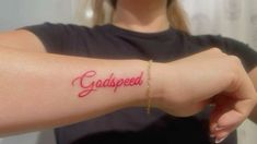 a woman with a tattoo on her arm that says, grapeseed