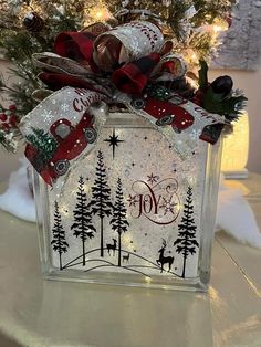 a glass block with christmas decorations on it