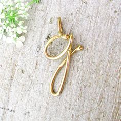 Handmade Script Initial Letter G Necklace Solid 14k Gold Charm 18mm x 9mm x 1mm This beautiful hand made script initial charm is hand made in solid 14 Karat Yellow Gold. This is also available in 14 Karat Rose Gold and 14 Karat White Gold. Add a chain and other charms to create a unique and totally personalized necklace. All individual letters and numbers are available, if you want a different letter or number, please just request it in a convo or as a special order request, otherwise it will come as shown. We can send you an image of the letter or number before we make and ship it. Choose your Gold Color Chains are optional. The Gold Filled Chains are high quality 14/20 Gold Filled. The 14 Karat Gold Chains are solid gold. If you order a chain it will match the pendant you ordered. ------ Gold Pendent, Script Initial, Monogram Pendant, Gold Letter, Letter G, Photo Locket, Gold Initial