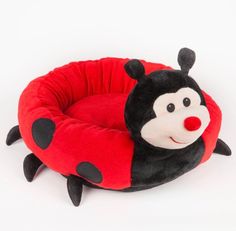 a ladybug dog bed is shown on a white background