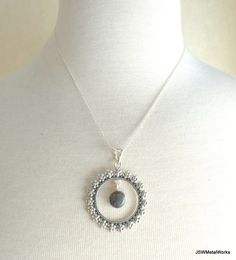 This beautiful floral solid sterling silver round pendant, with a dangling round labradorite or moonstone gemstone, is suspended on an 18 inch sterling silver 1mm cable chain. It is perfect for any occasion and is great for layering! Pendant height: 1.9 inches or 49mm, including bail Pendant width, at widest point: 1.5 inches or 38mm Dangling gemstone + silver setting diameter: 0.43 inches or 11mm Pendant setting and bail: sterling silver Convo me for a different length chain (additional charges Skull Earrings, Moonstone Necklace, Keep Jewelry, Round Pendant, Healing Crystals, Pendant Set, Teardrop Earrings, Crystals And Gemstones, Gift For Women