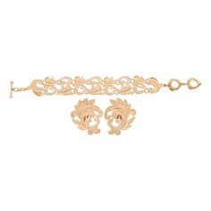 Refined golden metal lace like amazing set. Heart toggle closure. Signed "YSL Made in France". Numbered "E4". A must have ! Dimensions : -> Earrings Height approx. 4.8 cm (1.9 inch) Width approx. 3.8 cm (1.5 inch) -> Bracelet Overall length approx. 23.5 cm (9.3 inches) with two possible closing positions - first closing position approx. 20 cm (7.9 inches) - second closing position approx. 22.5 cm (8.9 inches) Saint Laurent Heart Earrings, French Jewelry, Chain Belts, Coin Earrings, Metal Lace, Pearl Brooch, Baroque Fashion, Yellow Gold Earring, Leaf Necklace