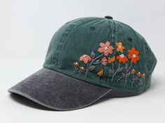 Flower is 100% hand embroidered on a 100% cotton wash baseball cap. Hat is one size fits all with adjustable back strap. Unique cap, one of a kind! I am also open for customization. If you want the item in different colors, please message me, it will take additional 2-3 days of handling time. Free first class shipping, upgradable priority mail service. 30 days return policy, feel confident at your purchase! Green Cotton Baseball Cap For Spring, Spring Green Cotton Baseball Cap, Green Cotton Trucker Hat For Spring, Spring Green Cotton Trucker Hat, Spring Outdoor Hat With Embroidered Logo, Spring Outdoor Baseball Cap With Embroidered Logo, Outdoor Baseball Cap With Embroidered Logo For Spring, Cotton Baseball Cap With Floral Embroidery, Floral Embroidered Cotton Baseball Cap