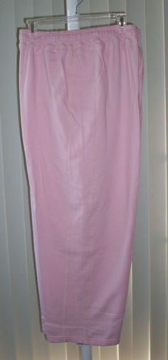 Sweat pants without pockets by Gold's Gym.  These have not been worn.  They have tags.  Size:  XL.  Color:  Pink.  Pants have elastic and drawstring in waist.  Straight legs.  They are by Gold's Gym but they do not have a logo on them.  Soft material.  80% cotton, 20% polyester.  Unstretched waist is 32 inches, inseam is 29 1/2 inches.  Shop Our Store For Other Womens Clothing!  Will ship multiple purchases together. Gold's Gym, Golds Gym, Pink Pants, Sweat Pants, A Logo, Soft Material, Pink And Gold, Pencil Skirt, Straight Leg