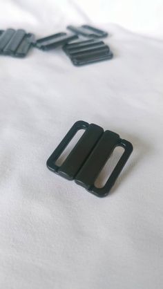 - Fits 20mm (3/4") elastic or strap - Ideal for back closure on bras, bralettes, dresses, or bikinis - Closes securely - Made from durable plastic  - Sourced as ex-designer deadstock, traditionally destined for landfill Seamless Black Beach Bra, Black Underwire Bra-friendly Swimwear, Black Micro-elastic Bra With Removable Pads, Black Swimwear With Built-in Bra And 4-way Stretch, Black Swimwear With Built-in Bra And Micro-elastic Fit, Elastic, Bra, Gift Card, Etsy Accessories