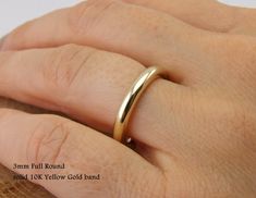 Attractive 10K Solid Yellow Gold ,Dainty Circular Band Ring Any of these ring has high polished , also matt finish available These Ring is SOLID 10 K GOLD, not plated nor filled, each af item has includes 41.7% Pure gold mean 10K These Unique Handmade items are produced with our old aged local process, so any rings are definitely unique. GUARANTEED 100% AUTHENTIC SOLID GOLD We reduce the gold with high quality Europen Alloy catching naturel color of 10K. The Width is 3mm. rounded style The other 14k Gold Thick Band For Wedding, Wedding Thick Band Ring In 14k Gold, 14k Gold Wedding Band With Thick Shape, Round Wedding Band, Thick Ring, Yellow Wedding, Small Jewelry, Pure Gold, Gold Style