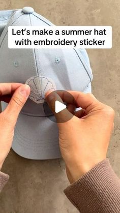 two hands holding a baseball cap with the words let's make a summer hat with embroidery sticker