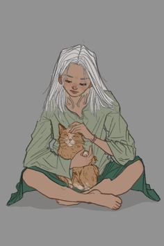 a woman sitting on the floor with a cat in her lap and holding it up to her chest