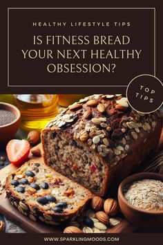 a loaf of bread sitting on top of a cutting board next to nuts and other foods