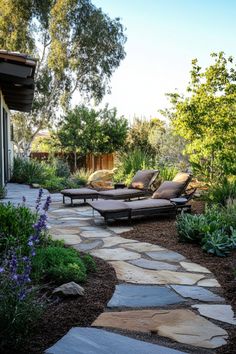 Outdoor garden with two lounge chairs on a stone pathway surrounded by greenery. Lake View Backyard Ideas, Large Backyard Hardscape Ideas, Backyard Landscaping Lake House, Boulder Outcropping Landscape, Lake House Plans, Outdoor Retreat, Backyard Makeover, Yard Landscaping, Backyard Landscaping Designs