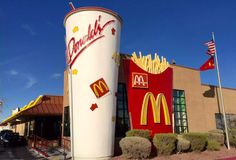 a giant mcdonald's sign in front of a restaurant