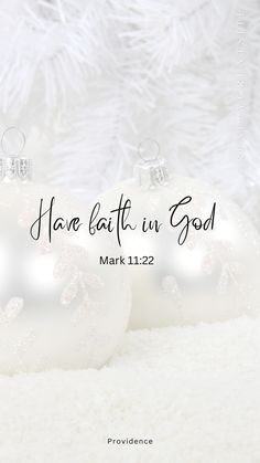 two white christmas ornaments with the words have faith in god on them, and an image of