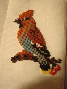 a close up of a towel with a bird on it