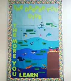 a bulletin board with the words, the ocean you dive and other marine life on it