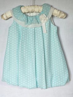 Balloon dress with turquoise lining, patterned with white hearts and a slightly ruffled double collar decorated with a white rose. With a zip at the back. In a 1920s look! Synthetic material, cotton underdress. Suitable for girls aged around 18 months Cute White Dress With Ruffled Collar, Cute Dress-up Dress With Ruffled Collar, Cute Ruffled Collar Dress For Dress-up Occasions, Cute Dress With Ruffled Collar For Dress-up, Cute Dress With Ruffled Collar For Dress-up Occasions, Blue Summer Dress With Ruffled Collar, 1920s Looks, Turquoise Pattern, Balloon Dress