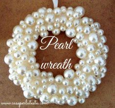 a wreath made out of pearls with the words pearl wreath written in white on it