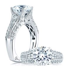 an engagement ring and wedding band set with diamonds on the side, in white gold