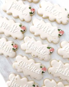 decorated cookies with names and flowers on them