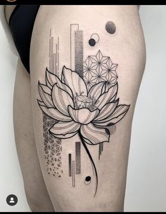 a woman's thigh with a flower tattoo on it