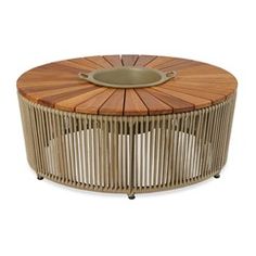 a round wooden table with an iron plate on it's top and wood slats around the edge