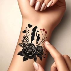 a woman's arm with a tattoo on it that has flowers and a man holding a child