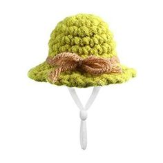 a green crocheted hat with a bow on the brim and brown ribbon