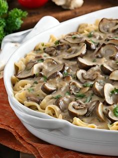 a casserole dish filled with pasta and mushrooms