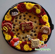 a birthday cake decorated with cookies and decorations