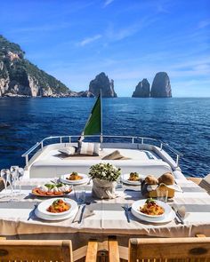 the table is set for two on the boat