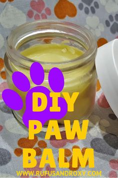 a jar of dog paw butter sitting on top of a table