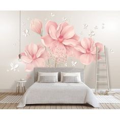 a bedroom with pink flowers on the wall