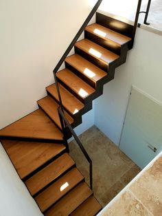 a stair case with wooden steps in a house