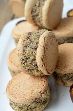 several cookies are stacked on top of each other with one cookie in the foreground