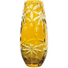 a yellow glass vase sitting on top of a table