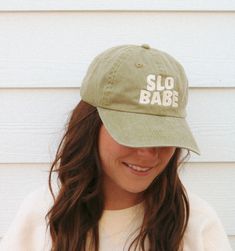 The Slo Babe Hat is perfect for the laidback individual. Crafted from 100% cotton twill, the unstructured, low-profile hat features a garment washed, pigment-dyed finish for a lived-in look. The slide closure with brass buckle and grommet ensures a secure fit. Get a comfortable, casual look with the Slo Babe Hat. Fabric: 100% cotton twill Structure: Unstructured Profile: Low Closure: Self-fabric slide closure with silver buckle and grommet Hat Fabric, Fine Linen, Brass Buckle, Casual Look, Low Profile, Cotton Twill, Casual Looks, Buckle, Brass