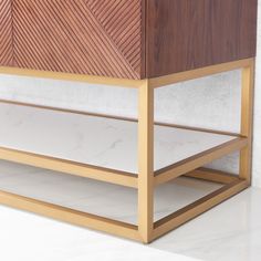 a wooden cabinet sitting on top of a white floor