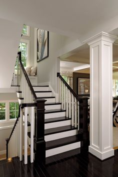 there is a black and white staircase in the house