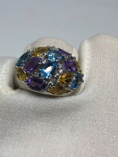 Huge great color blue topaz amethyst citrine and white sapphires stone setting is handcrafted in 925 sterling silver Can be sized, my jeweler charges $10. All rings are shipped in a nice gift box. Check out our over a THOUSAND great reviews Engraving is $4 per letter and is not always perfect depending on the piece. It can take a few days if the jeweler is busy. This is payable to Paypal Judithsltd@gmail.com Oval Multi-stone Topaz Gemstones, Fine Jewelry Topaz Gemstones With Gemstone Accents, Fine Jewelry Gemstones With Topaz Accents, Topaz Gemstones With Gemstone Accents, Fine Jewelry Topaz Multi-stone Rings, Fine Jewelry Multi-stone Topaz Rings, Multi-stone Diamond Topaz Ring, Sapphire Multi-stone Topaz Ring, Oval Multi-stone Blue Topaz Gemstones