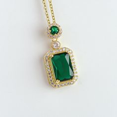 This elegant piece is crafted with premium grade stainless steel and a beautiful green zirconia. It's the easiest way to add a touch of luxury and style to any outfit. Whether you're dressing up for a special occasion or just looking to add a bit of sparkle to your everyday look, this necklace is a must-have! Chain length: 15.3" + 2" extender Emerald Necklace Gold, Gold Emerald Necklace, Green Gemstone Necklace, Emerald Jewellery, Gemstone Pendant Necklace, Necklace Green, Silver Coat, Emerald Necklace, Necklace Gemstone